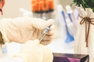 Doctor handling a needle of Botox. Honolulu based clinic, Hawaii Facial Plastic Surgery performs this treatment regularly.